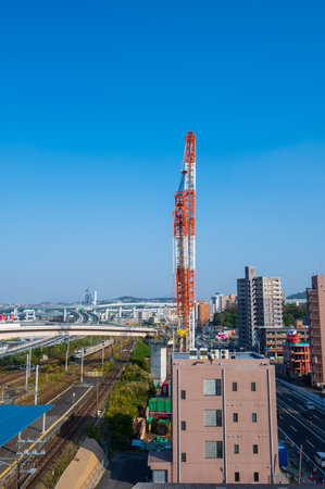 A large crane towering in a beautiful blue skyのeditorial素材
