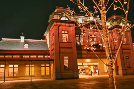 Cherry blossoms blooming at Mojiko Station at nightの写真素材
