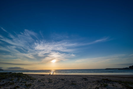 Sunset on the beach in the evening. Beautiful seascape.