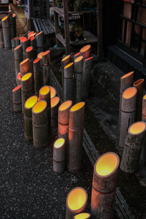 It is a winter light festival that was held on February 11, 2023 in Yamaga City, Kumamoto Prefecture, Japan, where Japanese umbrellas and bamboo lanterns were lit up at night.の写真素材