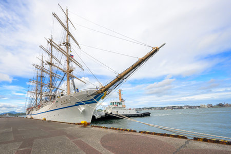 August 31, 2023, Japan, Fukuoka Prefecture, Kitakyushu City, Nippon Maru anchored on the west coast of Moji Port with blue skies and summer cloudsのeditorial素材