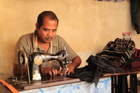 Flores Indonesia - May 04,2013, Local tailor working hard at local market in Bajawa Flores Indonesiaのeditorial素材