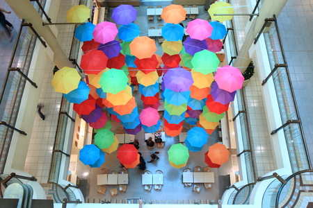 Melbourne Australia- August 31,2013, Locals having lunch under colourful umbrella display at a shopping mall in Melbourne Australiaのeditorial素材