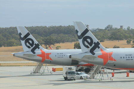 MELBOURNE AUSTRALIA - MARCH 14, 2014  Jetstar airplanes prepare for departure at Melbourne Airport のeditorial素材