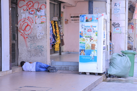 Kuala Lumpur Malaysia - 24 May, 2014  Unidentified man sleeps on a pavement  There are bout 800 people who are homeless and live on pavements and bus stops in Kuala Lumpur  のeditorial素材