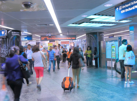 Singapore, Singapore - 26 May, 2014  Tourist and local people commute at Orchard MRT station...
