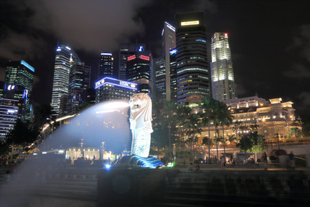 Singapore, Singapore - 27 May, 2014   Beautiful Singapore Skyline and Merlion by night in downtown Singapore  のeditorial素材