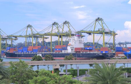 Singapore, Singapore - 28 May, 2014  Large cargo ship loads cargos in Port of Singapore in...