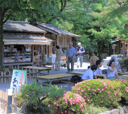 Kanazawa Japan - 6 June, 2014 Tourists rest at traditional Kiosk in Kenrokuen Garden in Kanazawa...