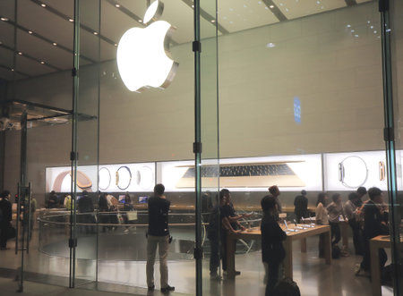 Tokyo Japan - May 8, 2015: People shop at Apple computer shop in Aoyama Tokyo.のeditorial素材
