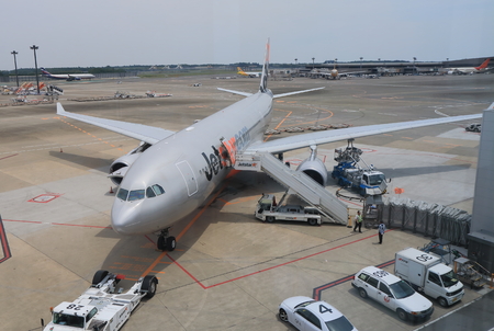 Tokyo Japan - May 23, 2015: Jetstar airplane prepares for departure at Narita airport.のeditorial素材