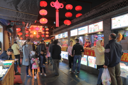 Beijing China - October 24, 2016: Unidentified people visit Wangfujing shopping district.のeditorial素材