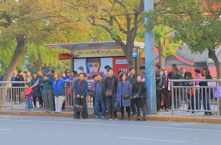 Beijing China - October 26, 2016: Unidentified people wait for bus in Beijing.のeditorial素材