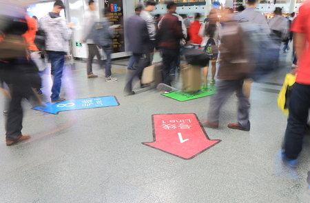 Shanghai China - October 30, 2016: Unidentified people coute at People's Square subway station.のeditorial素材
