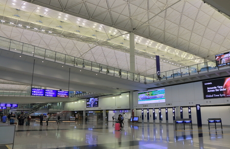 Hong Kong - November 7, 2016: Unidentified people travel at Hong Kong international airport train station.のeditorial素材