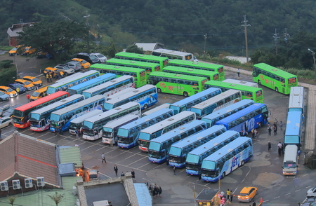 Taipei Taiwan - December 5, 2016: Tour buses wait for passengers at Jiufen parking area.のeditorial素材