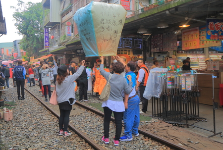 Taipei Taiwan - December 5, 2016: Unidentified people fly sky lantern in Shifen town. Shifen is an old railroad town and popular tourist destination.のeditorial素材