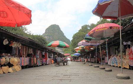 Yangshou China - November 18, 2016: Unidentified people visit West street. West street is a main commercial street with restaurants bars and gift shops.のeditorial素材