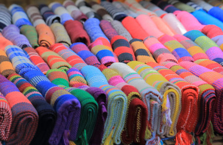 Yangshou China - November 19, 2016: Xingping street market souvenir shop sells colourful scarf.