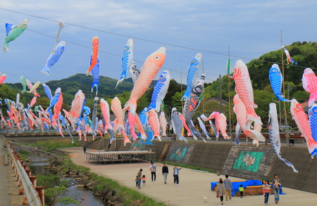 Ishikawa Japan - May 5, 2017: People visit Koinobori festival in Wajima Ishikawa Japan. Koinobori is carp shaped wind socks traditionally flown in Japan to celebrate Tango no sekku children's day.のeditorial素材