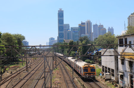 Mumbai India - October 12, 2017: Mumbai Bombay downtown skyscraper cityscape and city train in...