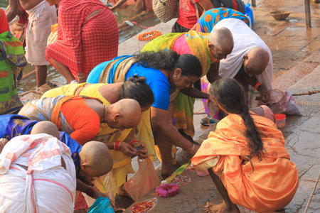 Varanasi India - November 2, 2017: People pray in Ganges river ghat in Varanasi India.のeditorial素材