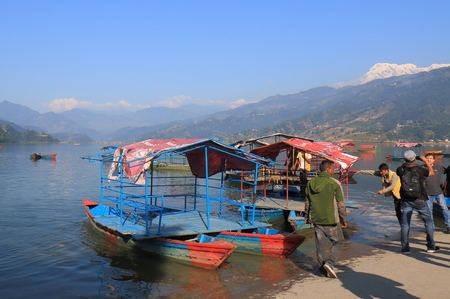 Pokhara Nepal - November 7, 2017: People take Fhewa lake boat cruise in Pokhara Nepal.のeditorial素材