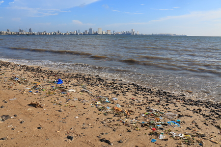 Rubbish scattered in Chowpatty beach Mumbai India.の写真素材
