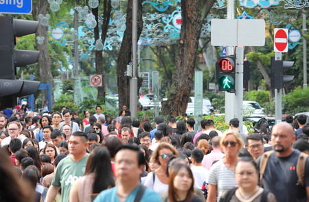 Singapore-November 17, 2018: Unidentified people visit Orchard road shopping area in Singapore.のeditorial素材