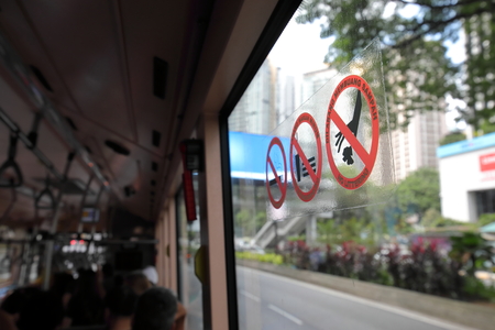Kuala Lumpur Malaysia - November 22, 2018: No eating, smoking littering sign on bus in Kuala Lumpur Malaysiaのeditorial素材