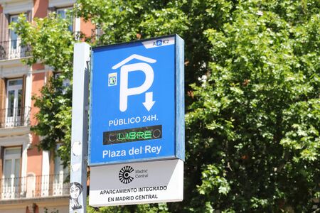 Madrid - Madrid 28, 2019: Public car parking sign in downtown Madrid Spainのeditorial素材