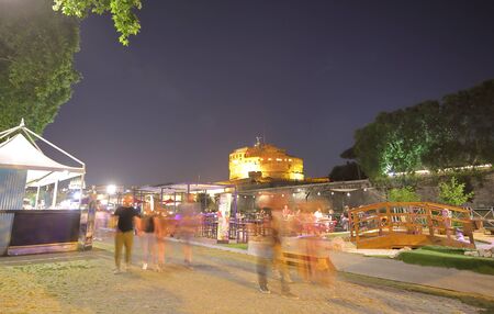 Rome Italy - June 16, 2019: People dine at restaurant on Tiber river bank Rome Italyのeditorial素材