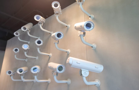 Surveillance video camera on wall