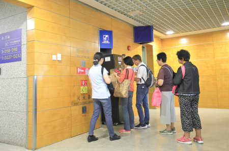 Shanghai China - June 20, 2019: People queue to refill water for free at Pudong airport Shanghai...