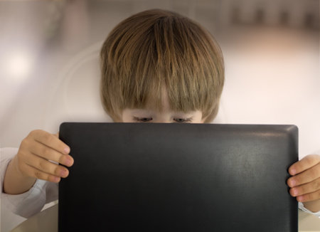 Little boy and laptopの写真素材