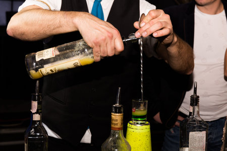 Barman shows how to make a cocktail