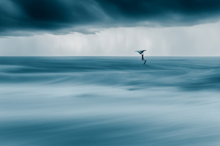Surfboarder in ocean on stormy day. Toned.の写真素材