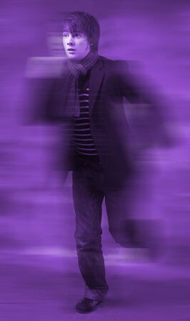 running businessman stressed and rushing. young adult in a hurryの写真素材