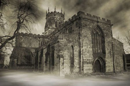 spooky english church in fog or haze. medieval christian buildingの写真素材