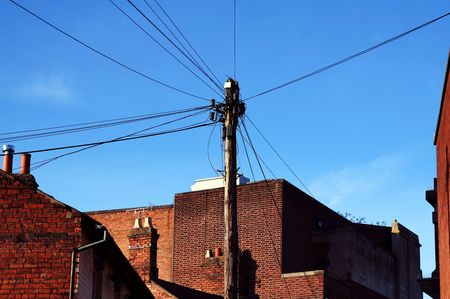 telephone communication lines connection. urban wire network between houses の写真素材