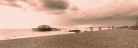 Brighton westpier and beach, the old burned down pier in evening lightの写真素材