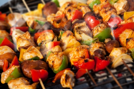 Bar-B-Q or BBQ with kebab cooking. coal grill of chicken meat skewers with mushroom and peppers. barbecuing dinnerの写真素材