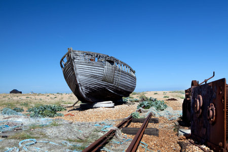abandoned fishing trawler on beach. old ship wreck on english south coast in dungeness