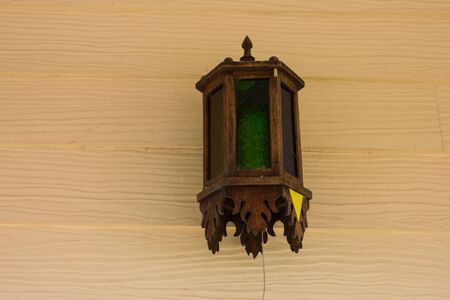 Lantern on a yellow wall vintage designの写真素材
