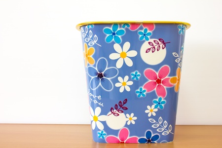 bin flower background design on wooden tableの写真素材
