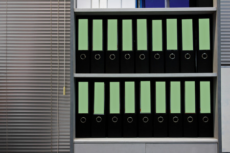 File folders standing on the shelves at officeの写真素材