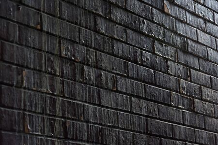 Old vintage weathered stained grunge red brick wall textureの写真素材