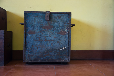 chest on an antique yellow wall  backgroundsの写真素材
