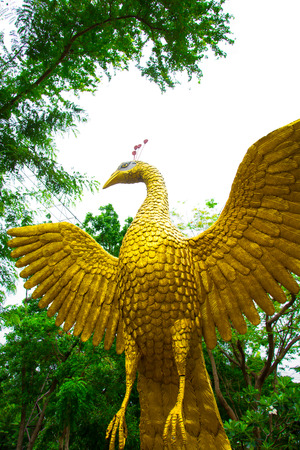 Figure peacock gold Statue Winged in gardenの写真素材