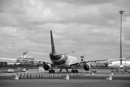 black and white Passenger planes at the airport shoot on the busのeditorial素材